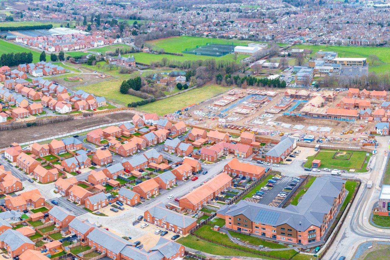 Development of new homes and a care home in Faversham on land promoted by Hallam Land. Aerial.