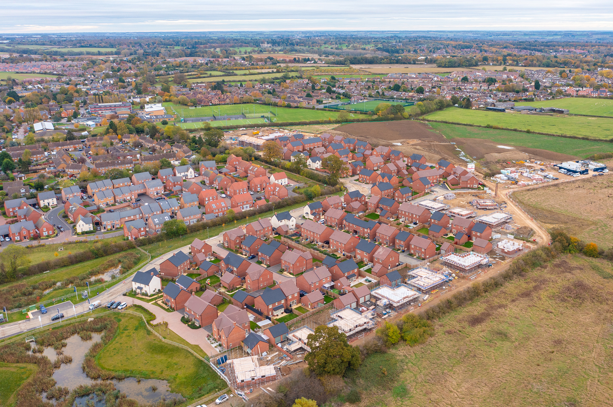 Development of new homes, promoting land through planning. Aerial view.