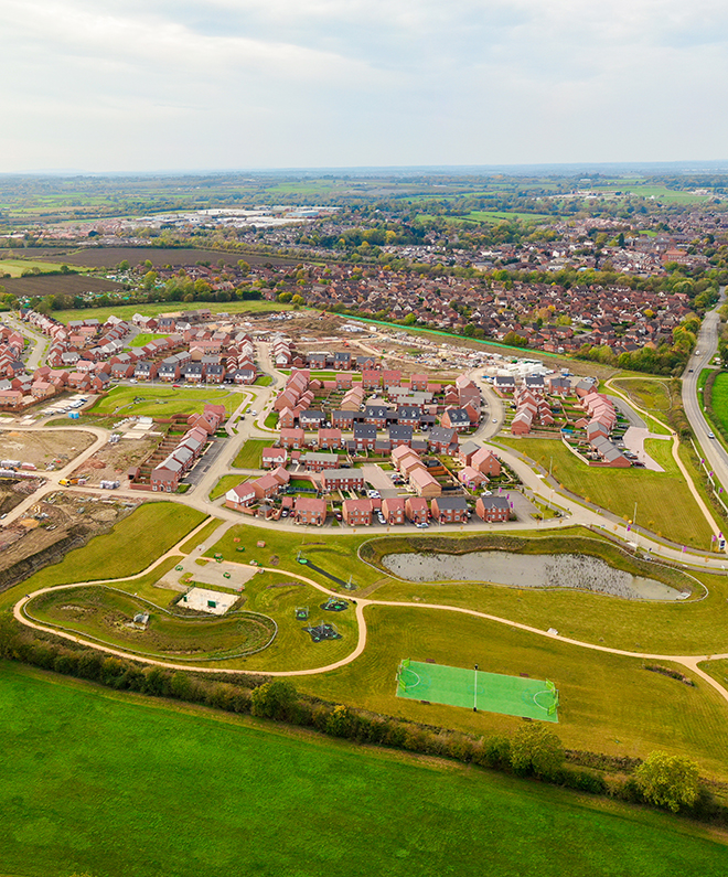 Strategic land being built on and converted into new homes. Aerial view.